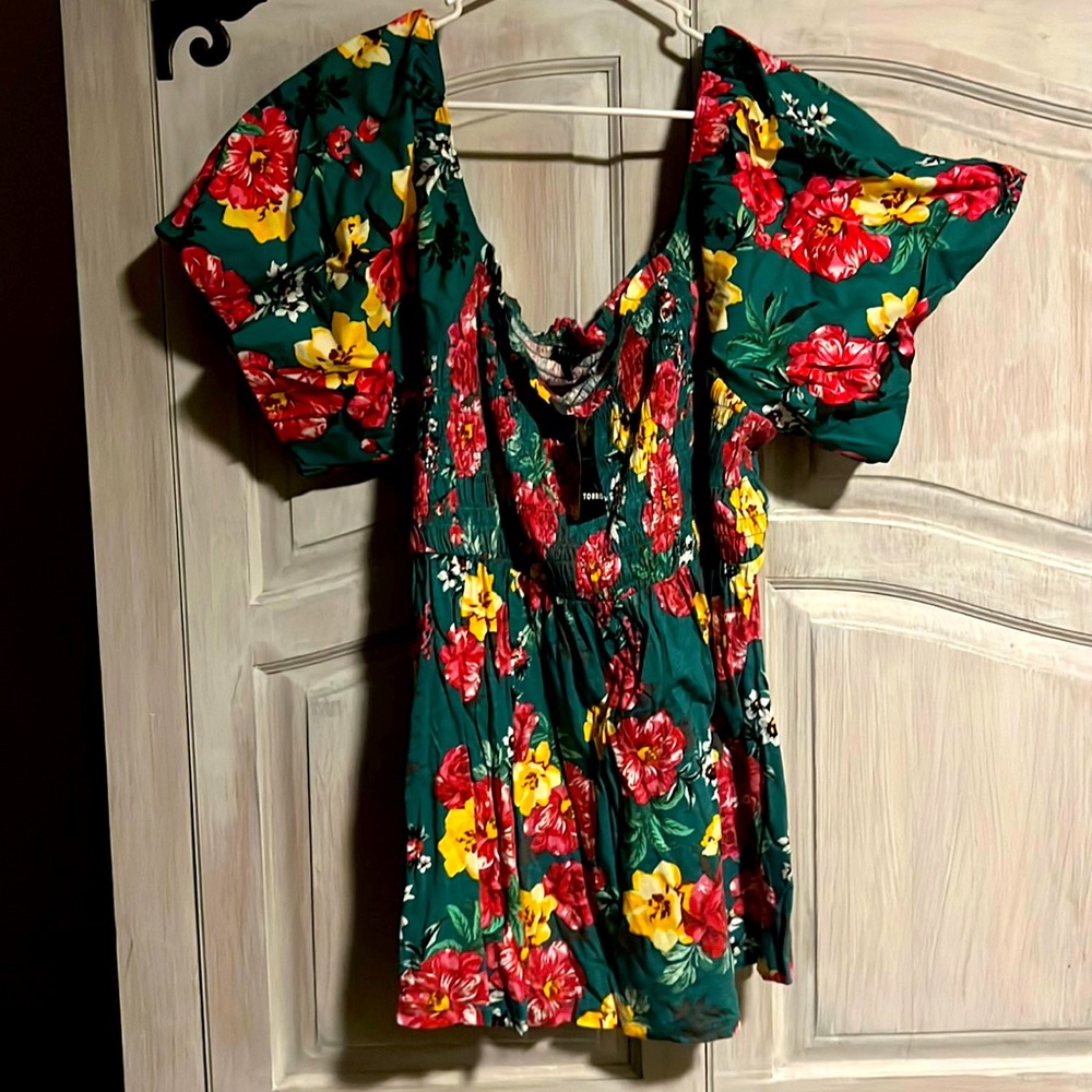 Colorful off the shoulder top. Buff like sleeves. Nice popping colors.